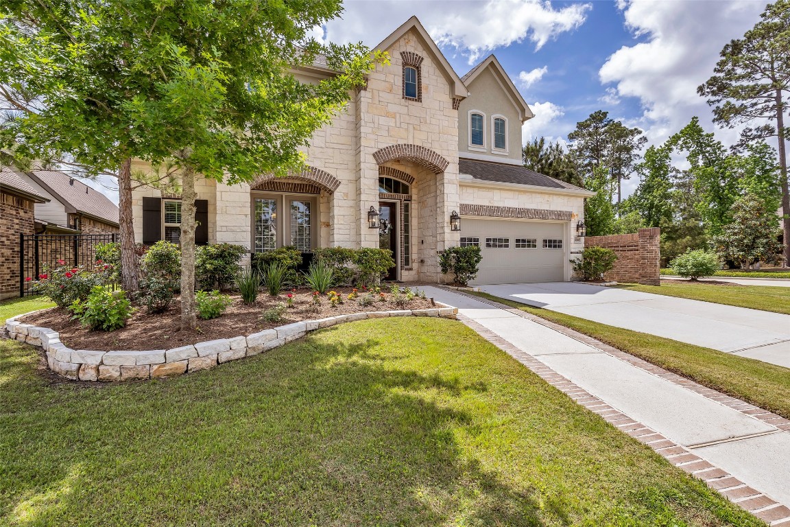 4060 Windsor Chase Drive Spring, TX 77386 - Photo 3 of 40 a front view of house with yard and outdoor seating