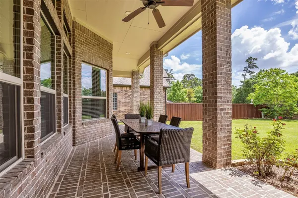 a view of a patio with a table and chairs