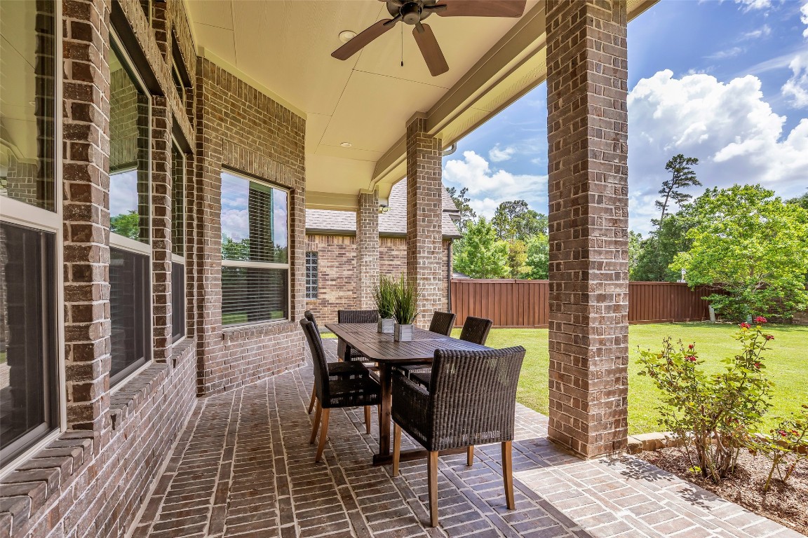 4060 Windsor Chase Drive Spring, TX 77386 - Photo 34 of 40 a view of a patio with a table and chairs