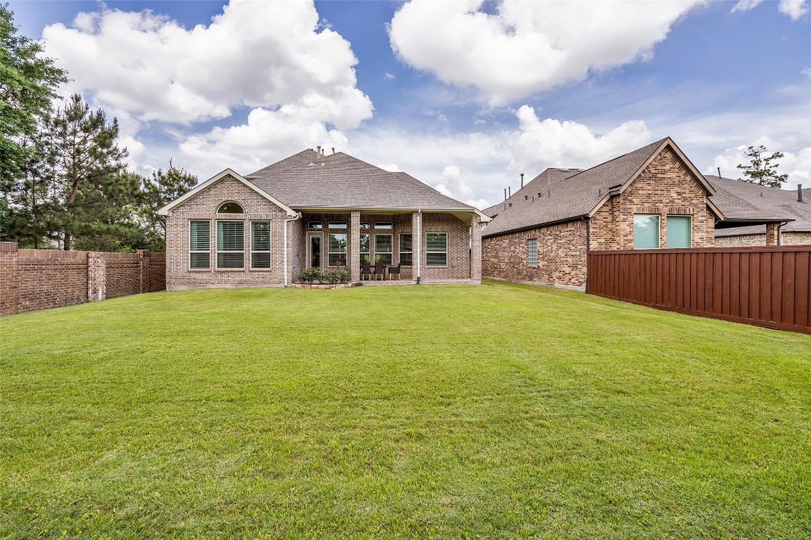4060 Windsor Chase Drive Spring, TX 77386 - Photo 38 of 40 a view of a house with a yard and wooden fence