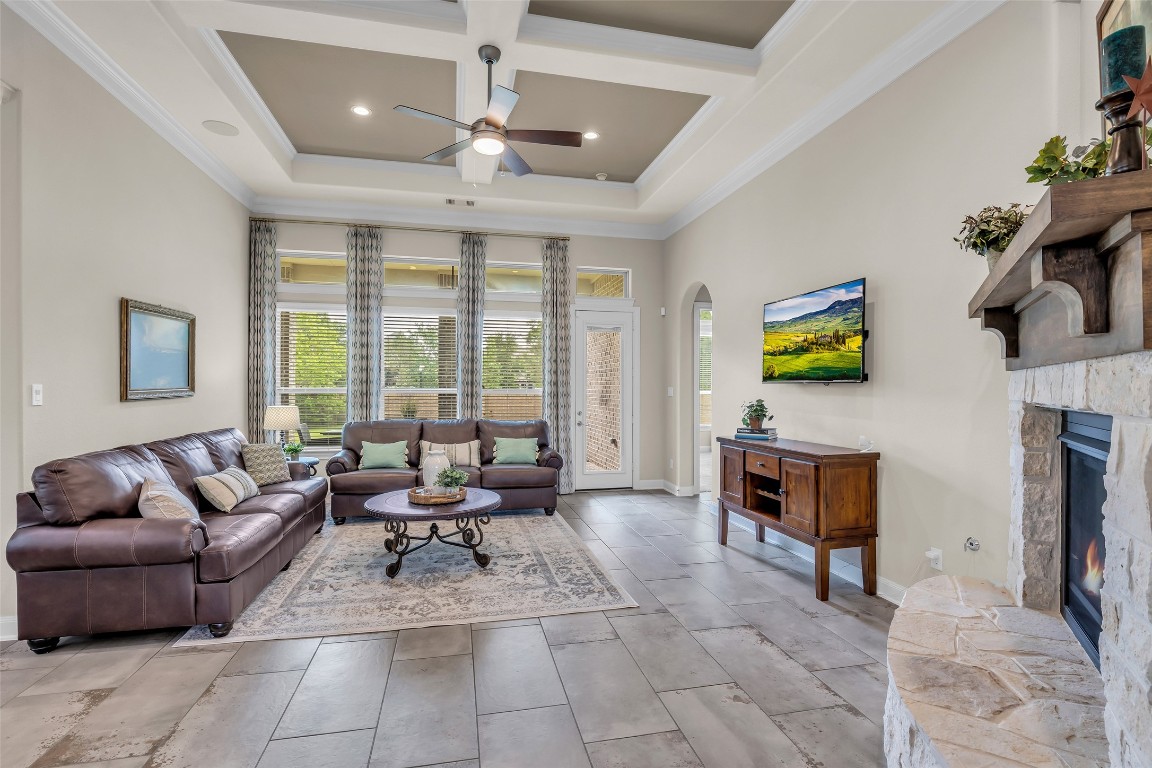 4060 Windsor Chase Drive Spring, TX 77386 - Photo 8 of 40 a living room with furniture a fireplace and a chandelier