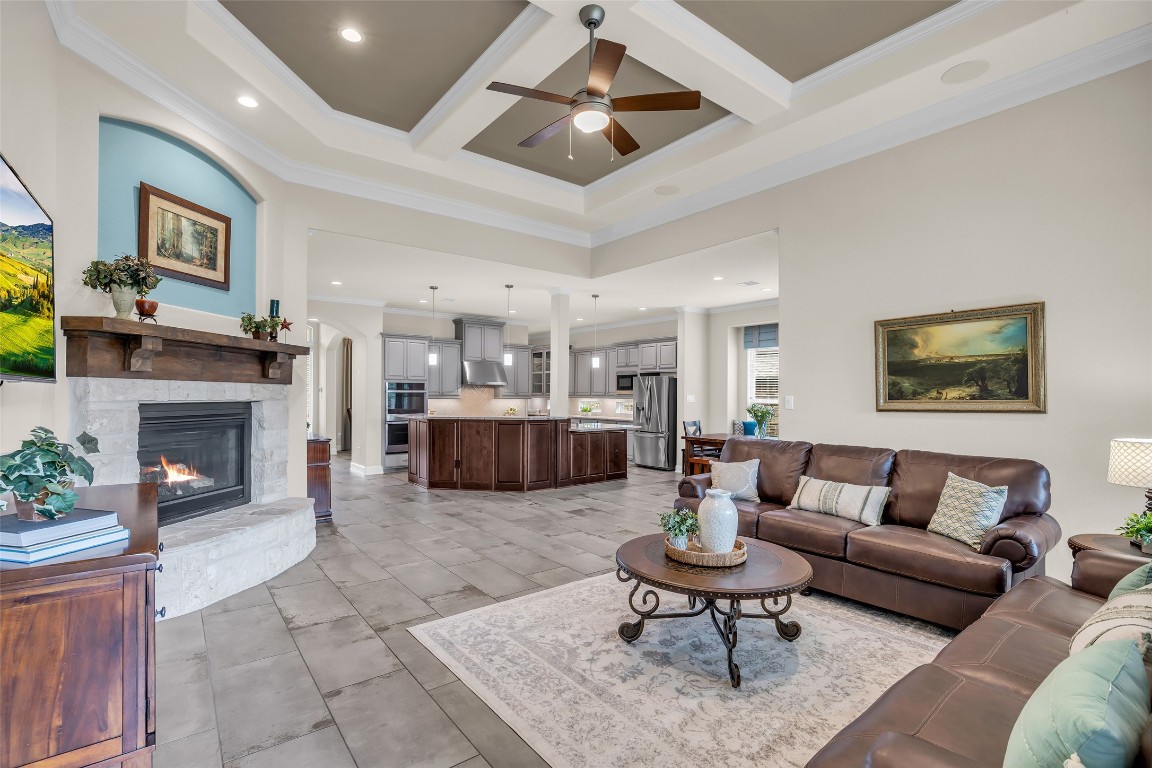 4060 Windsor Chase Drive Spring, TX 77386 - Photo 10 of 40 a living room with furniture a fireplace and a chandelier