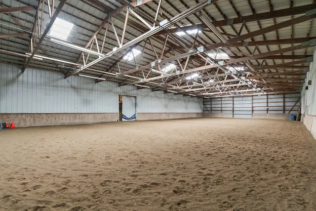 a view of a yard with wooden fence
