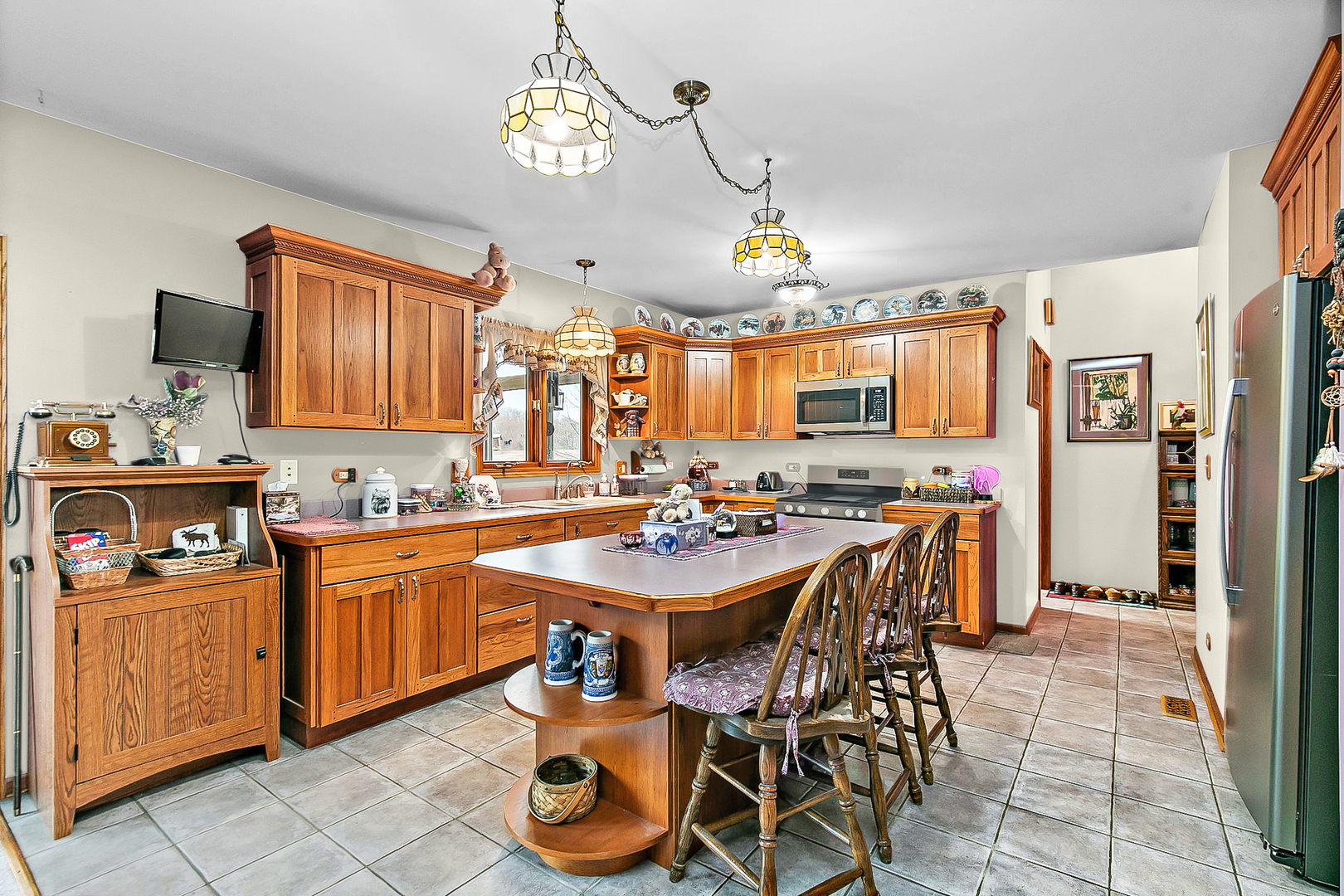 14N700 Factly Road Sycamore, IL 60178 - Photo 49 of 73 a kitchen with a dining table and chairs