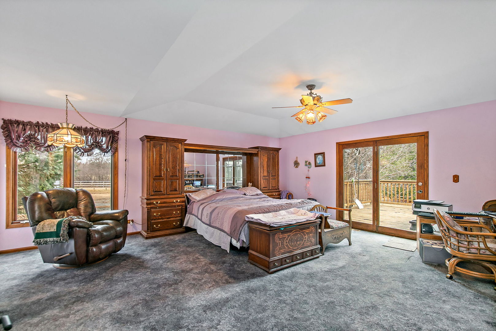 14N700 Factly Road Sycamore, IL 60178 - Photo 56 of 73 a spacious bedroom with a bed and a chandelier