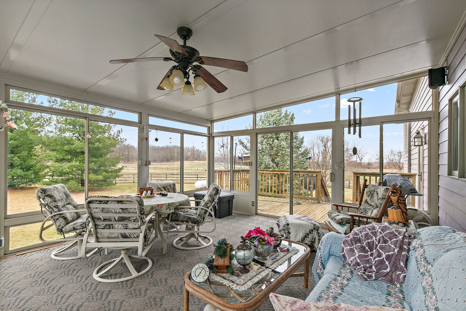 14N700 Factly Road Sycamore, IL 60178 - Photo 60 of 73 a living room with furniture and floor to ceiling windows