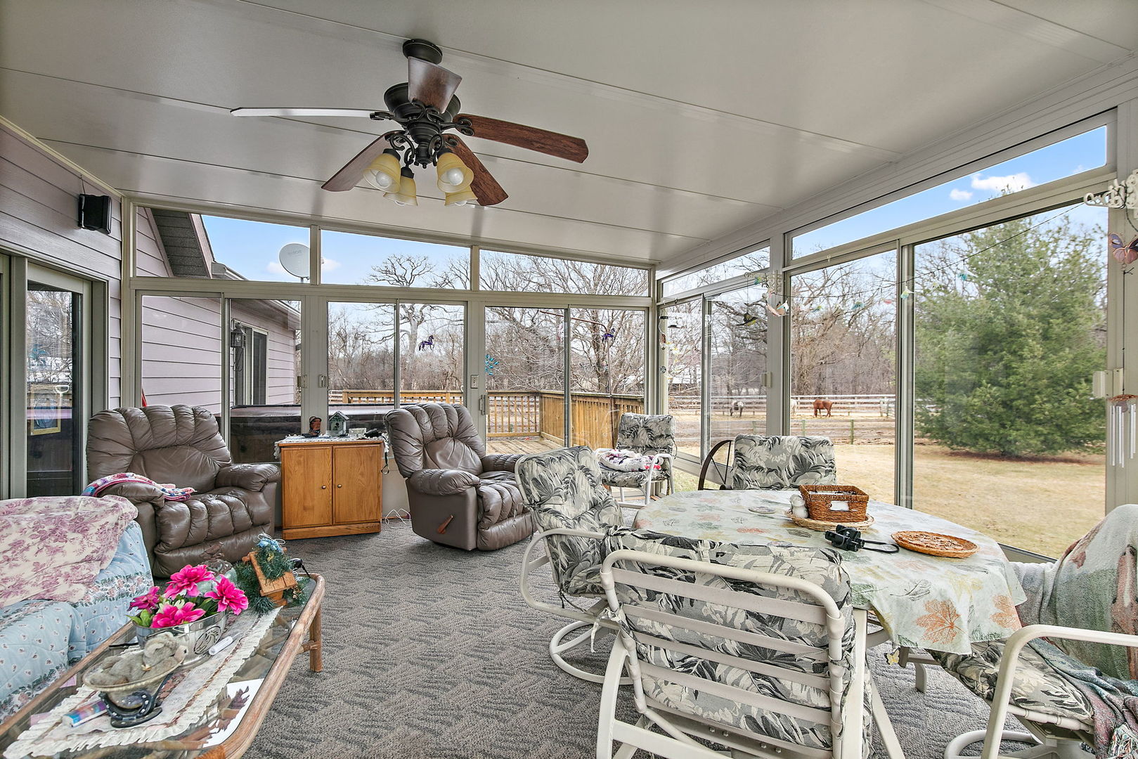14N700 Factly Road Sycamore, IL 60178 - Photo 61 of 73 a living room with furniture and floor to ceiling windows