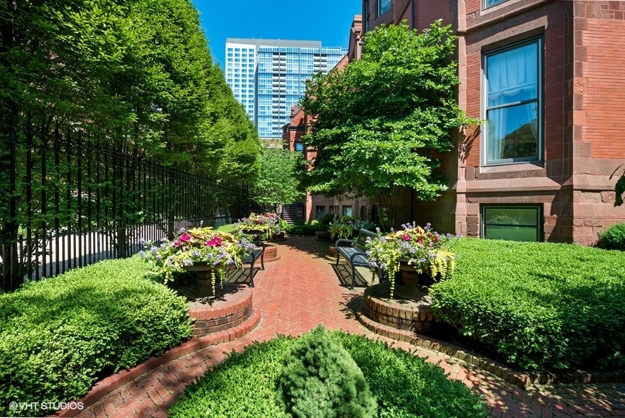 1919 South Prairie Avenue, Unit 5 Chicago, IL 60616 - Photo 2 of 19 a flower garden with flower plants in front of main door