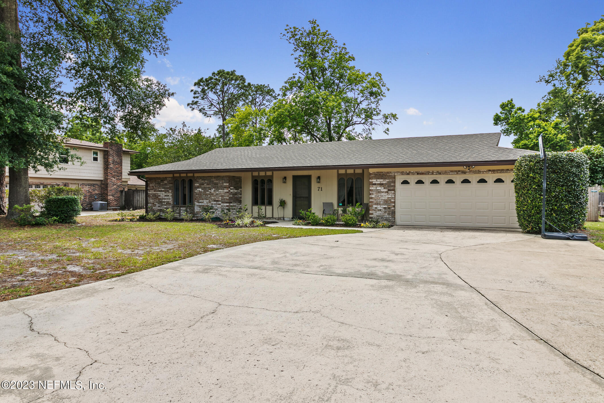 a front view of a house with yard