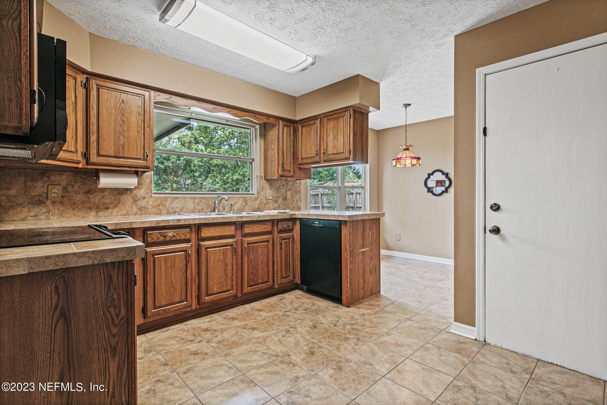 71 Vanderford Road East Orange Park, FL 32073 - Photo 11 of 52 a kitchen with stainless steel appliances granite countertop a refrigerator and a sink