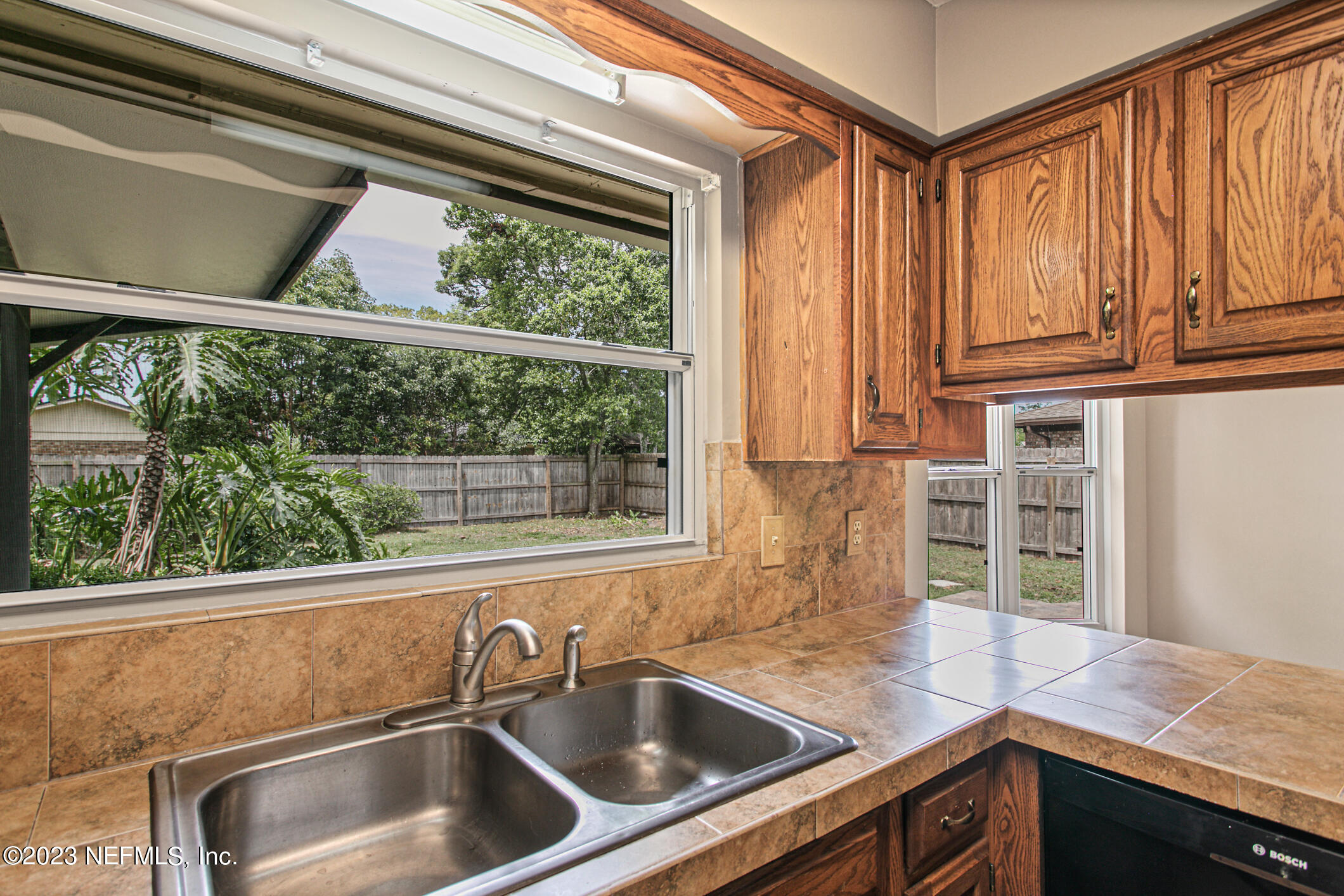 71 Vanderford Road East Orange Park, FL 32073 - Photo 13 of 52 a kitchen sink sitting next to a window