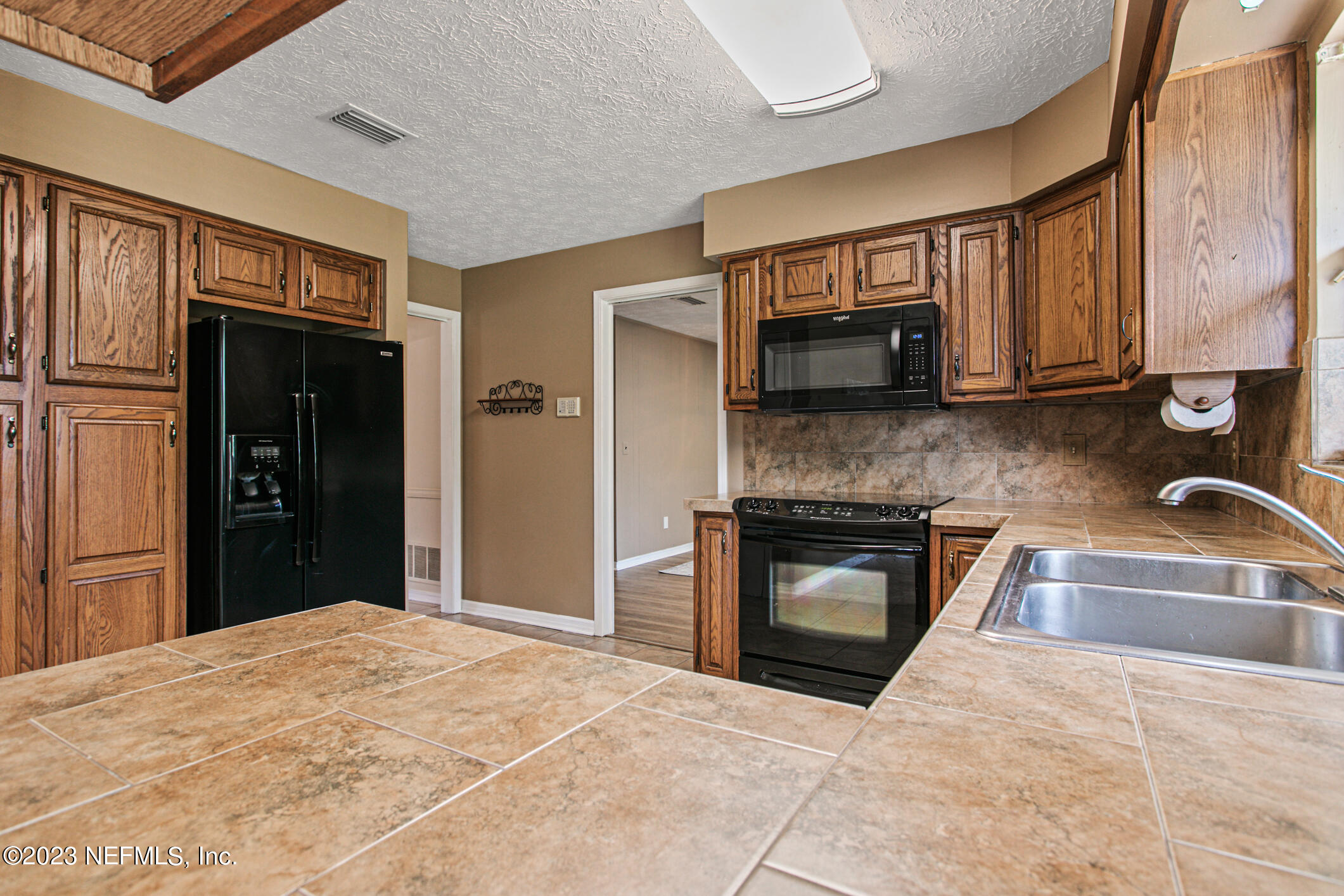 71 Vanderford Road East Orange Park, FL 32073 - Photo 15 of 52 a kitchen with a stove top oven and sink