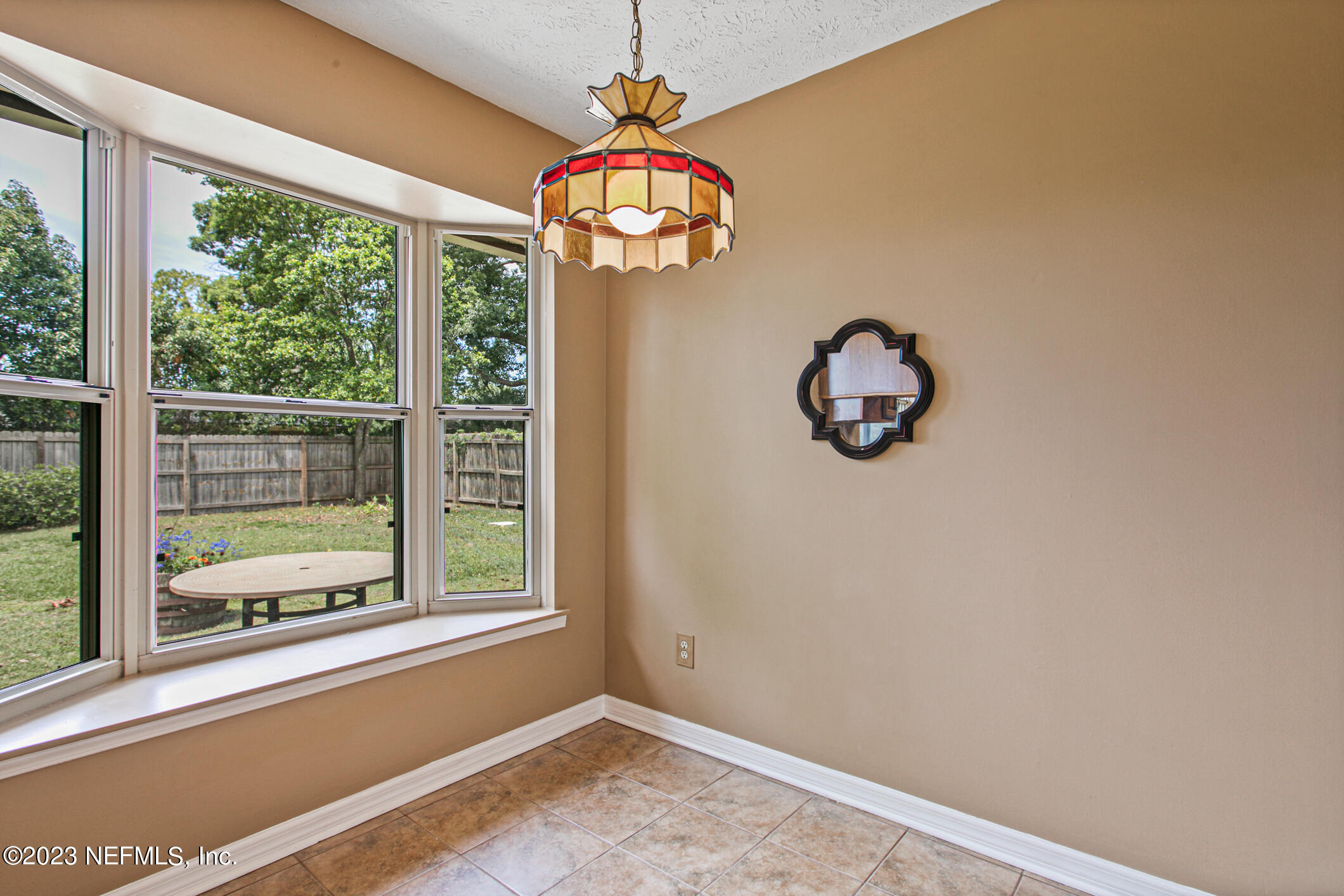 71 Vanderford Road East Orange Park, FL 32073 - Photo 16 of 52 a room with window and a chandelier