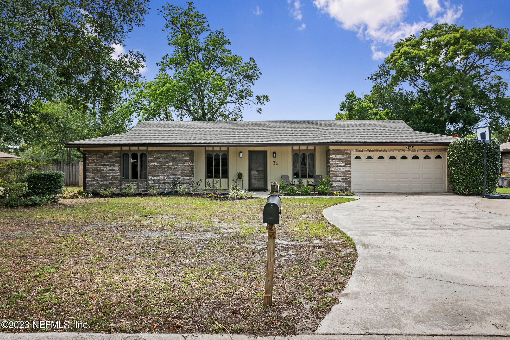 71 Vanderford Road East Orange Park, FL 32073 - Photo 2 of 52 a front view of a house with garden