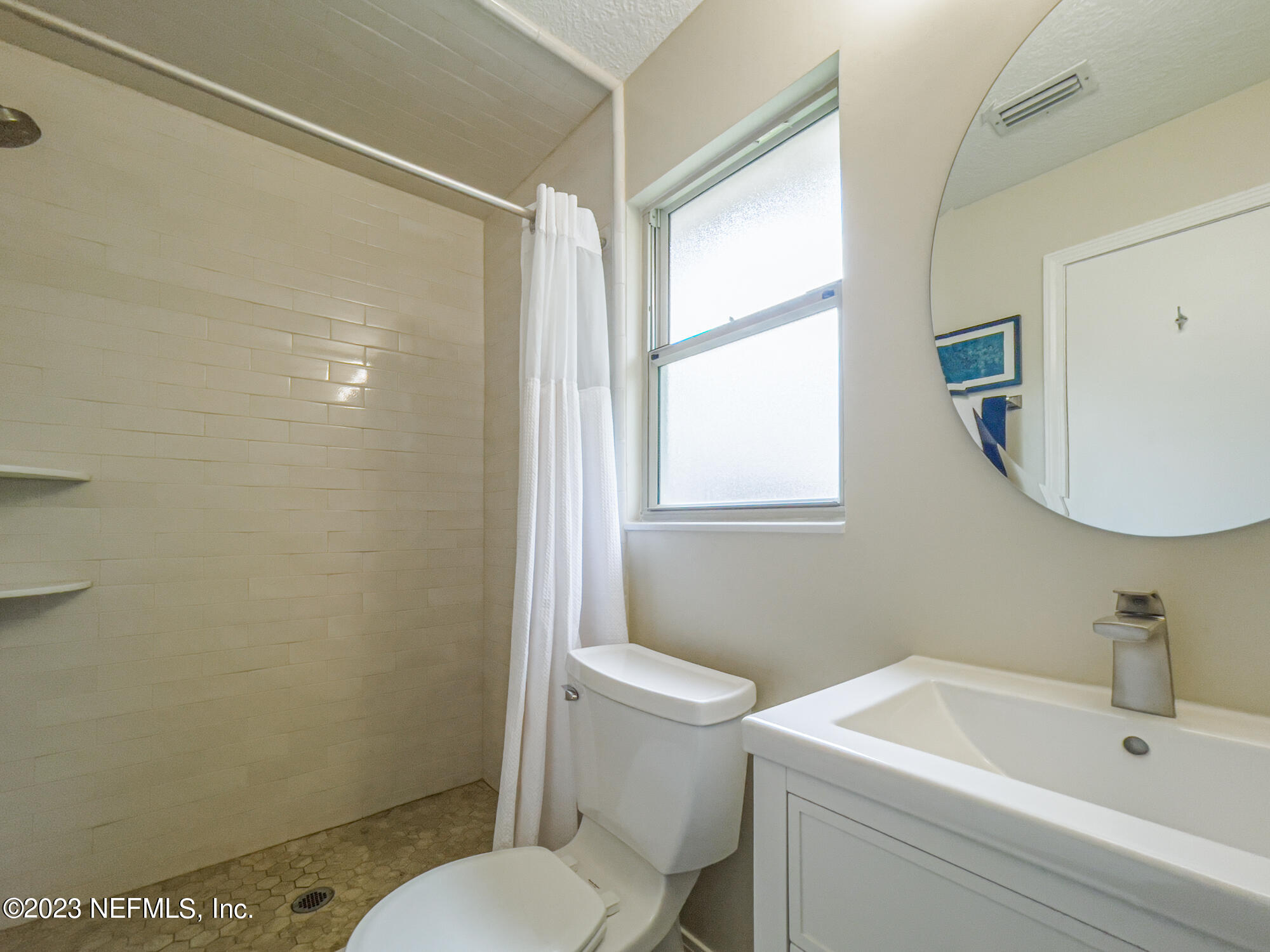 71 Vanderford Road East Orange Park, FL 32073 - Photo 28 of 52 a white toilet sitting next to a bathroom sink