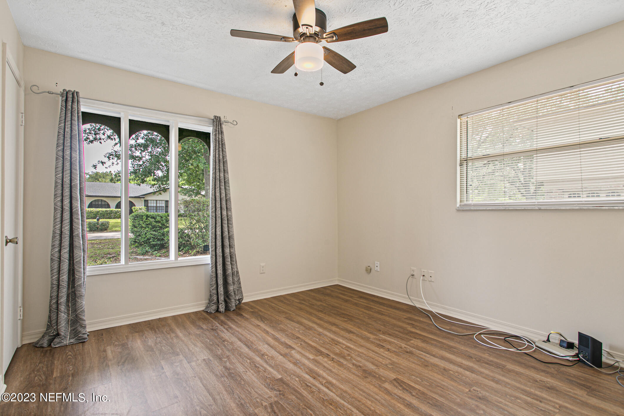 71 Vanderford Road East Orange Park, FL 32073 - Photo 30 of 52 a view of empty room with wooden floor and fan