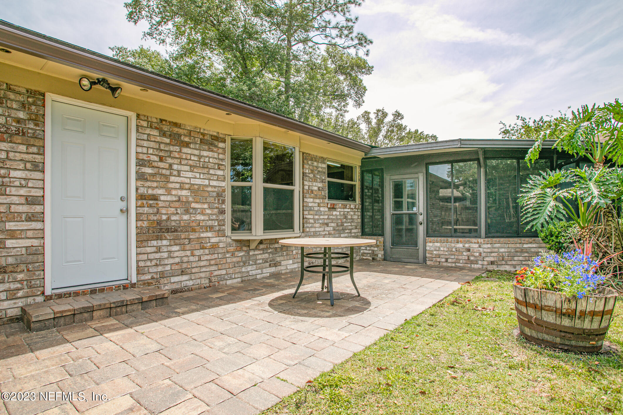71 Vanderford Road East Orange Park, FL 32073 - Photo 34 of 52 a front view of a house with outdoor seating