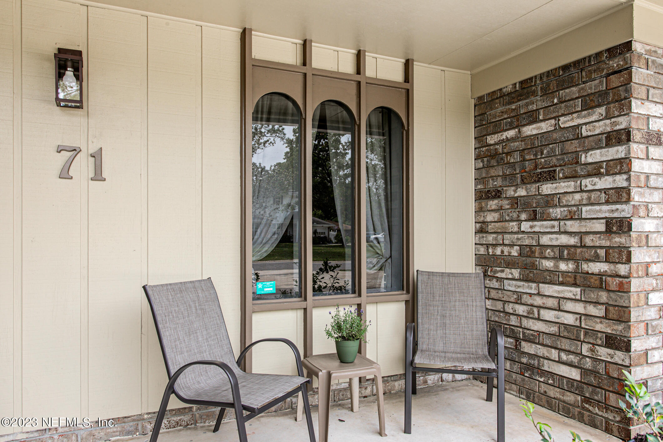 71 Vanderford Road East Orange Park, FL 32073 - Photo 4 of 52 a view of a chair and table in a livingroom