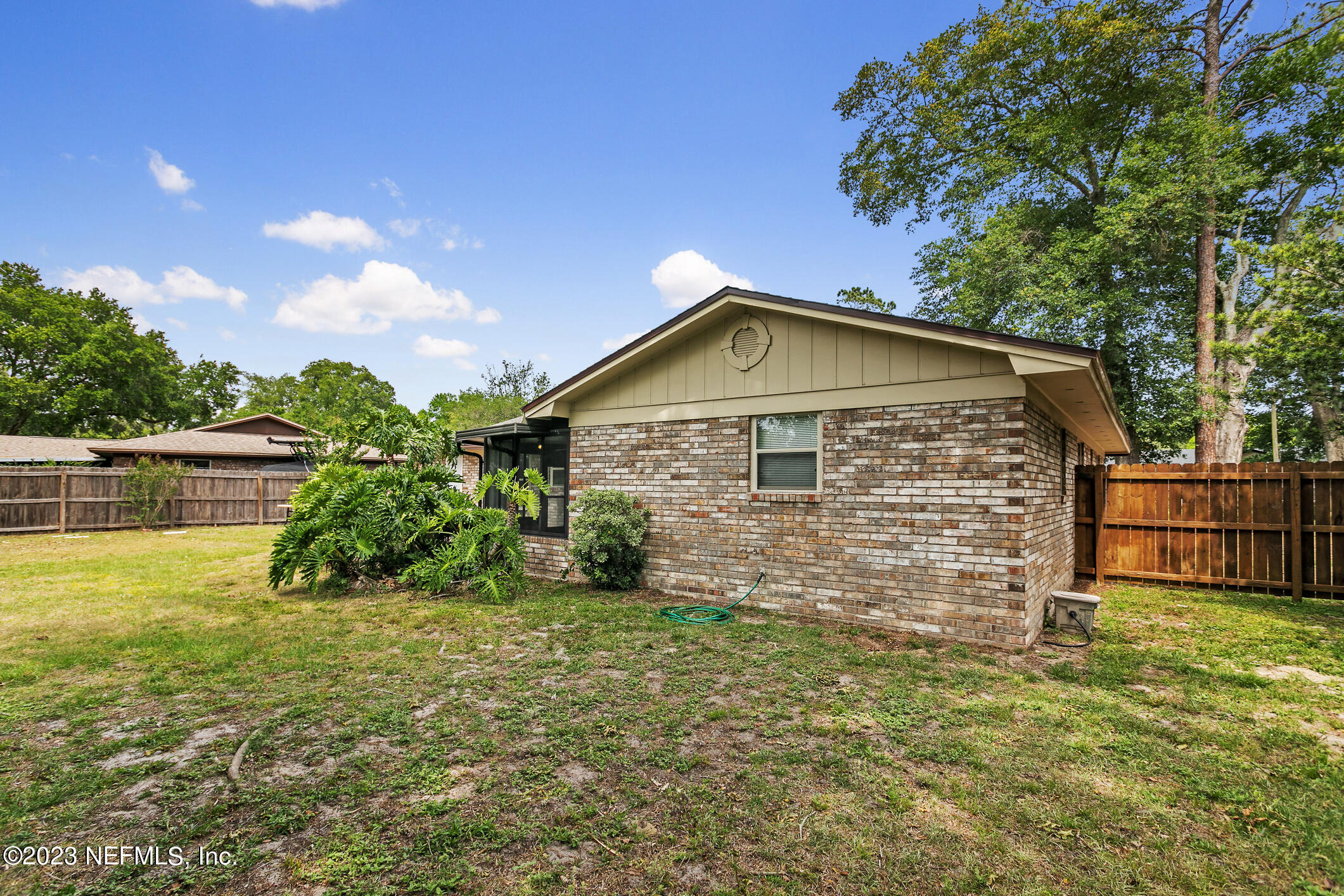 71 Vanderford Road East Orange Park, FL 32073 - Photo 45 of 52 a view of a backyard with plants and large tree