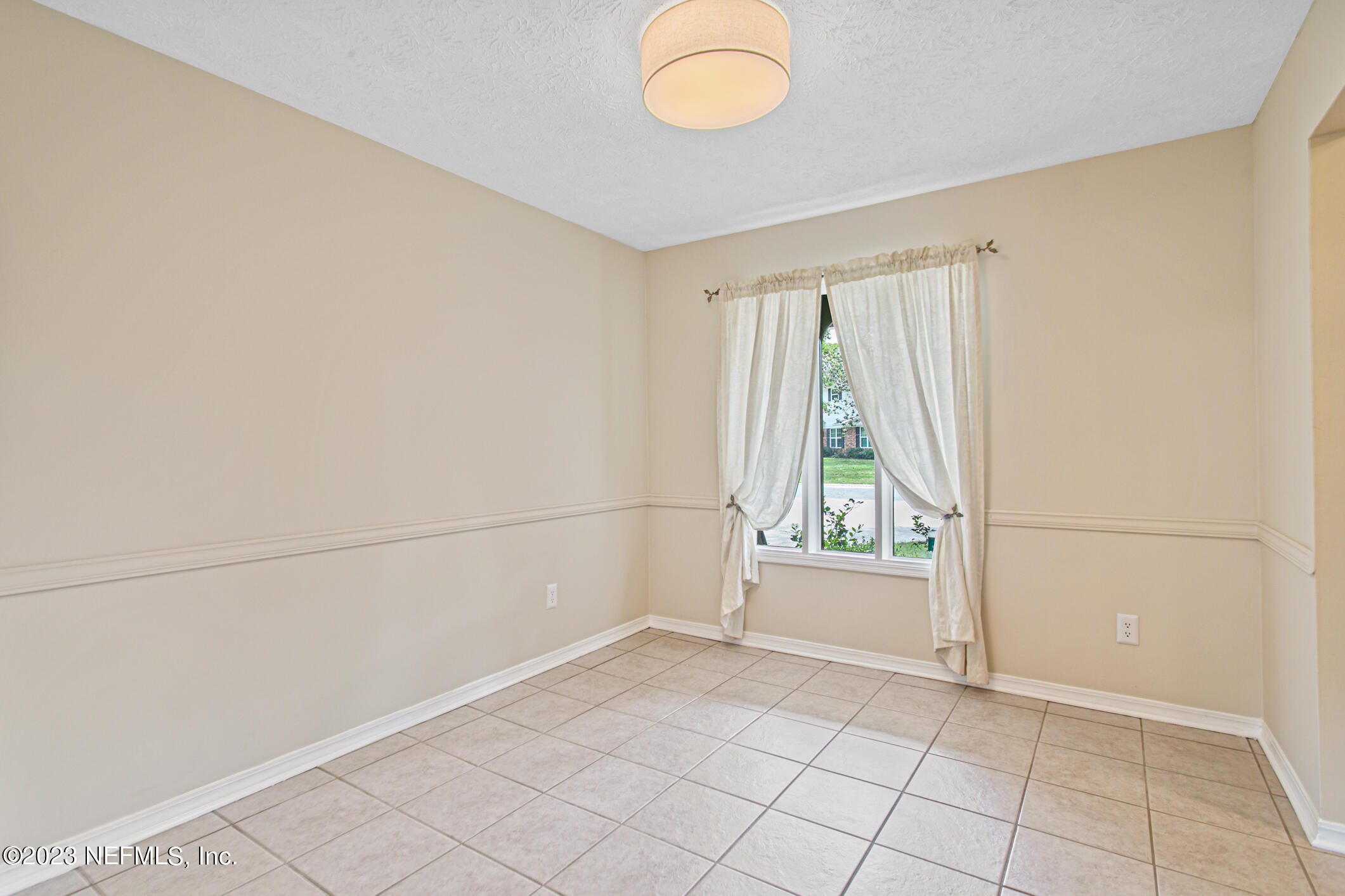 71 Vanderford Road East Orange Park, FL 32073 - Photo 8 of 52 a view of an empty room with a window