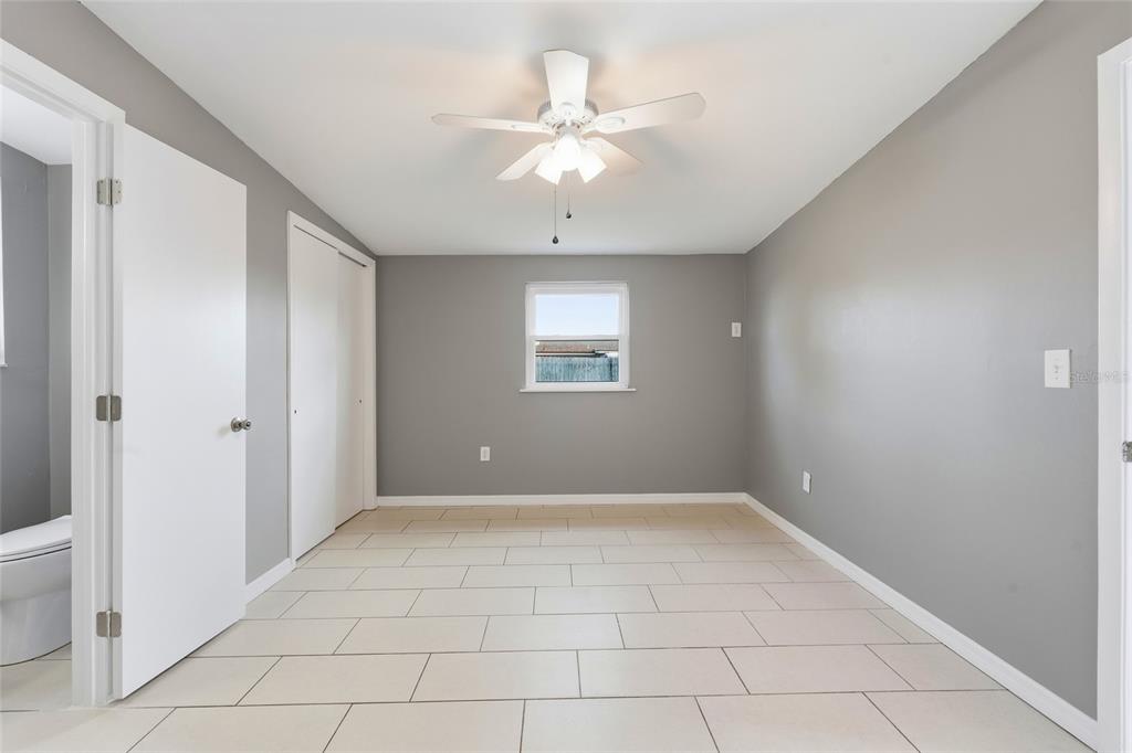 363 Glen Oak Road Venice, FL 34293 - Photo 31 of 53 wooden floor in an empty room with a window