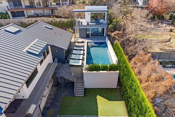 a aerial view of a house with a yard