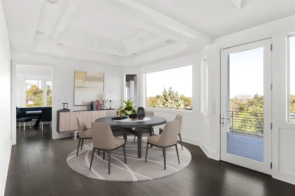 a view of a dining room with furniture window and wooden floor