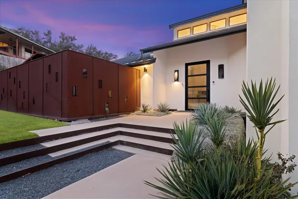 a house view with a garden space