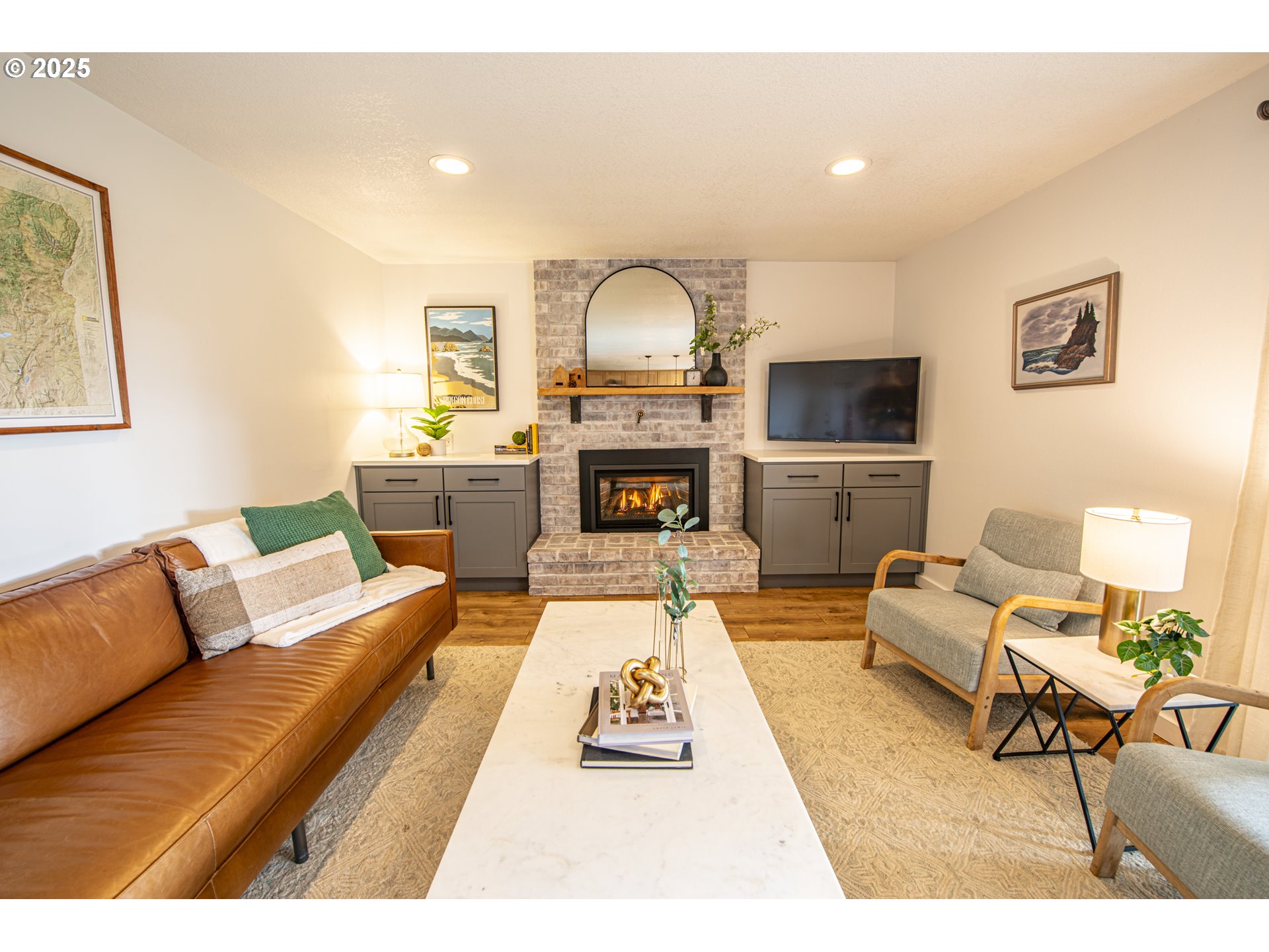 3052 Kentwood Drive Eugene, OR 97401 - Photo 16 of 43 a living room with furniture a fireplace and a flat screen tv