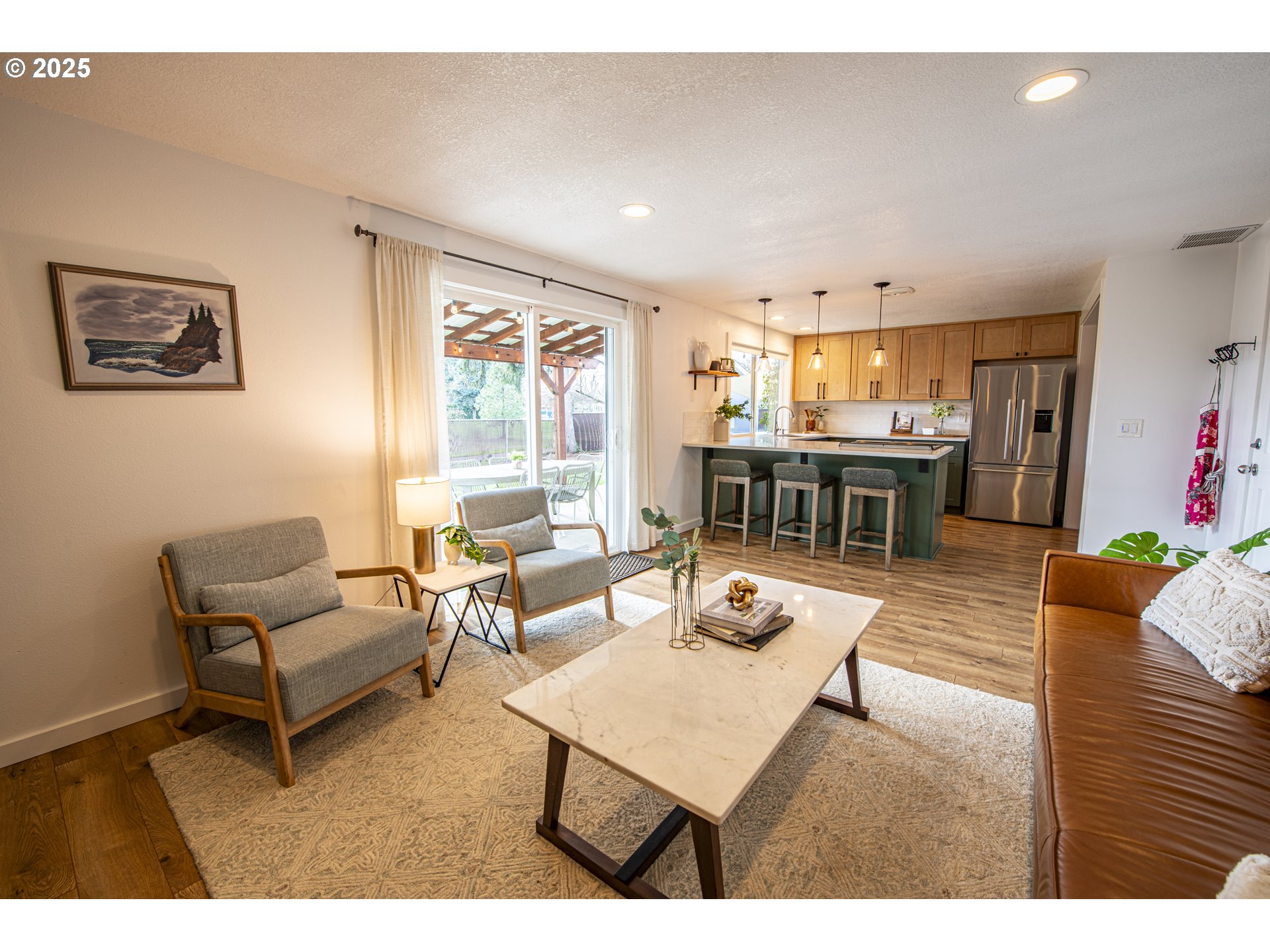 3052 Kentwood Drive Eugene, OR 97401 - Photo 17 of 43 a living room with furniture and a dining table