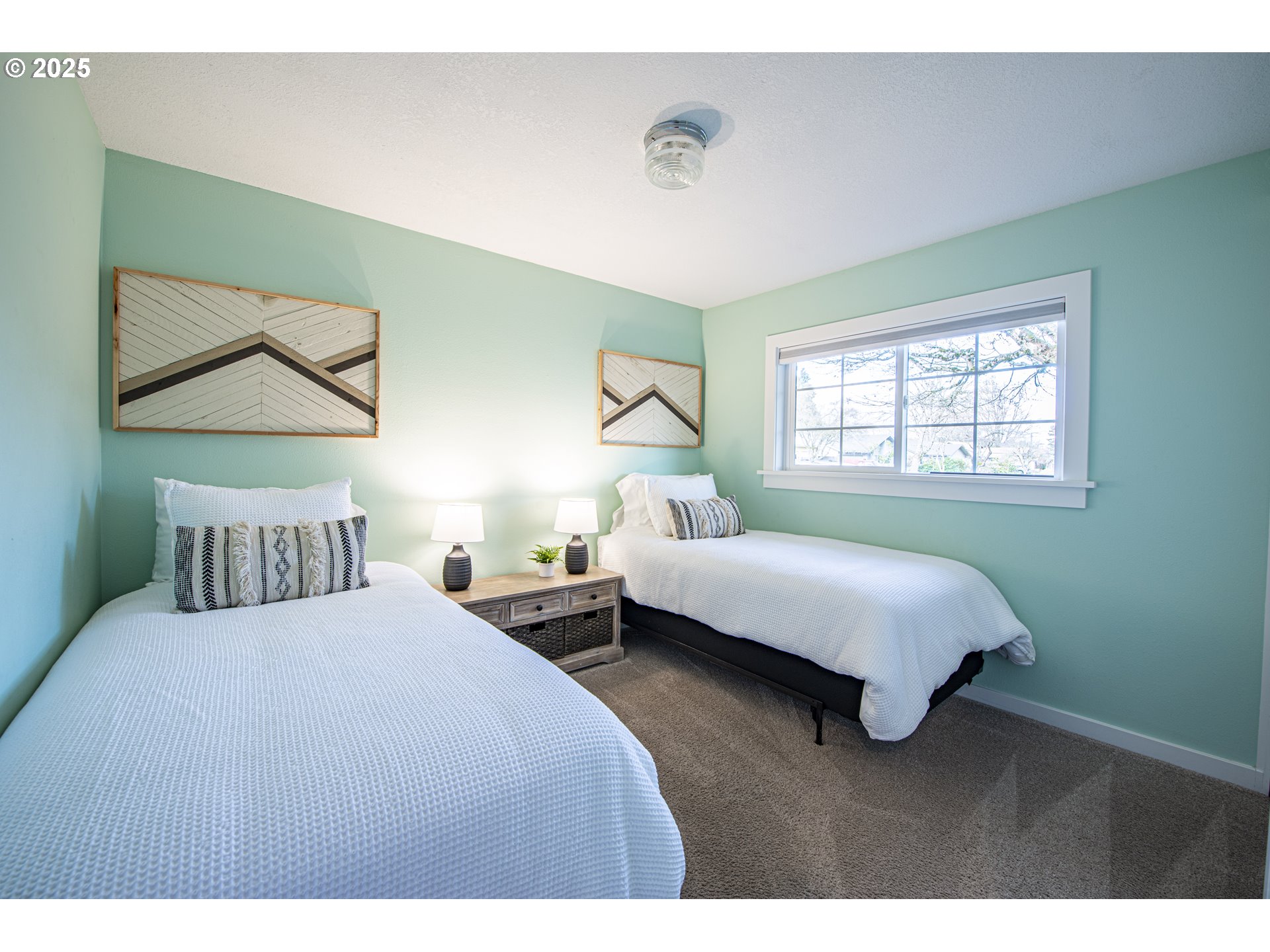 3052 Kentwood Drive Eugene, OR 97401 - Photo 20 of 43 a bedroom with a bed and a painting on the wall