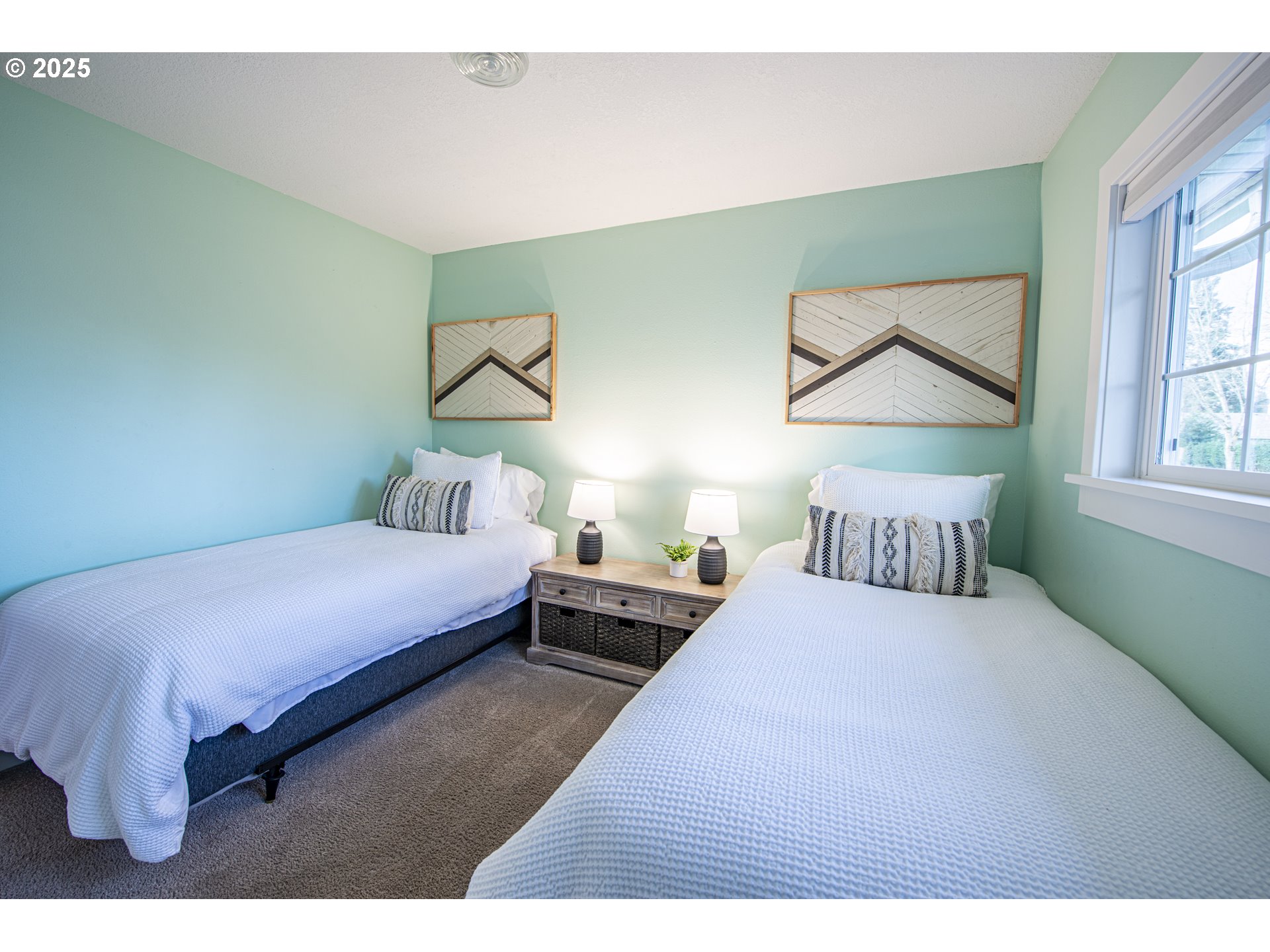 3052 Kentwood Drive Eugene, OR 97401 - Photo 21 of 43 a bedroom with a bed and a painting on the wall
