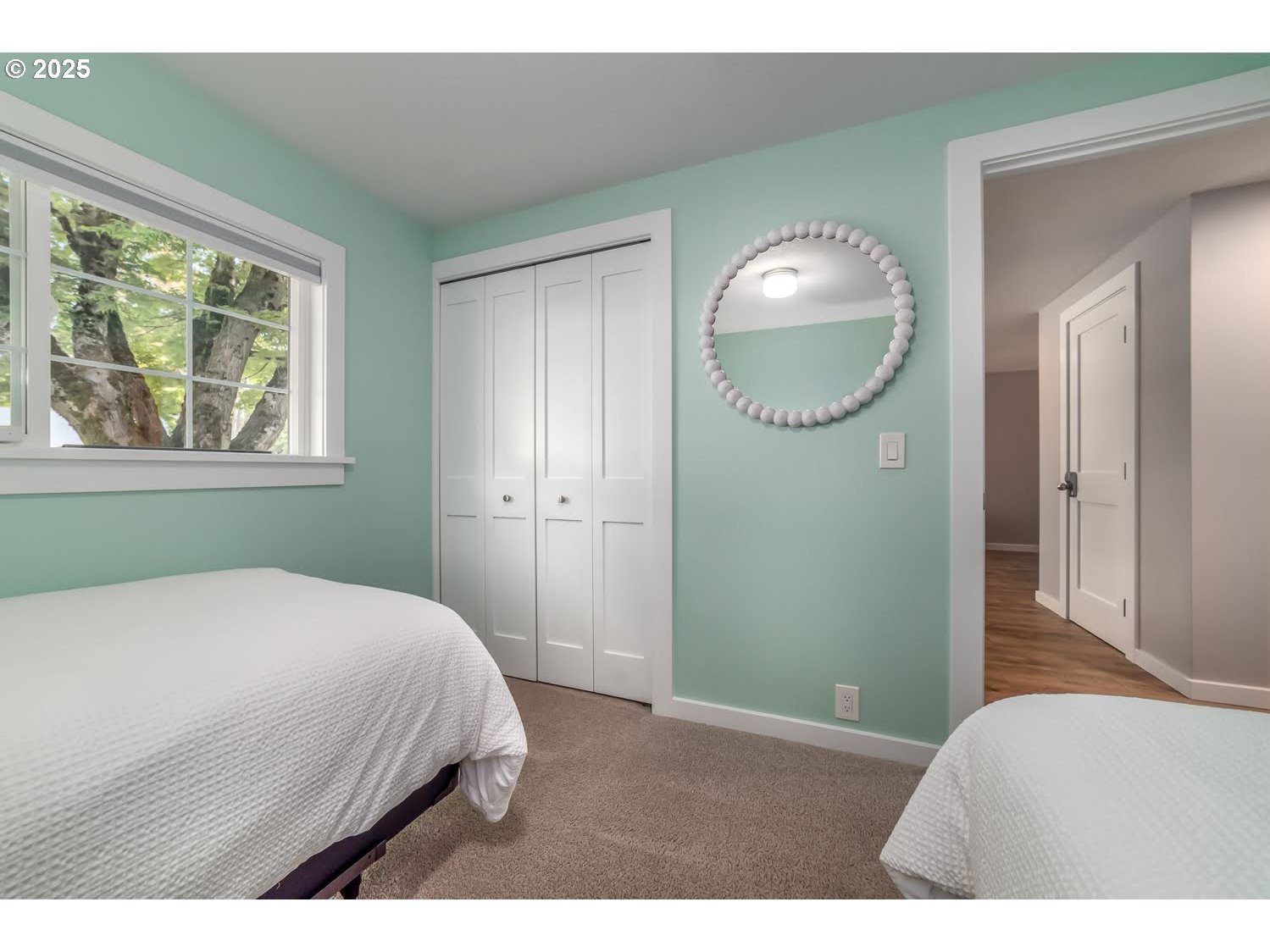 3052 Kentwood Drive Eugene, OR 97401 - Photo 22 of 43 a bedroom with a bed and a mirror