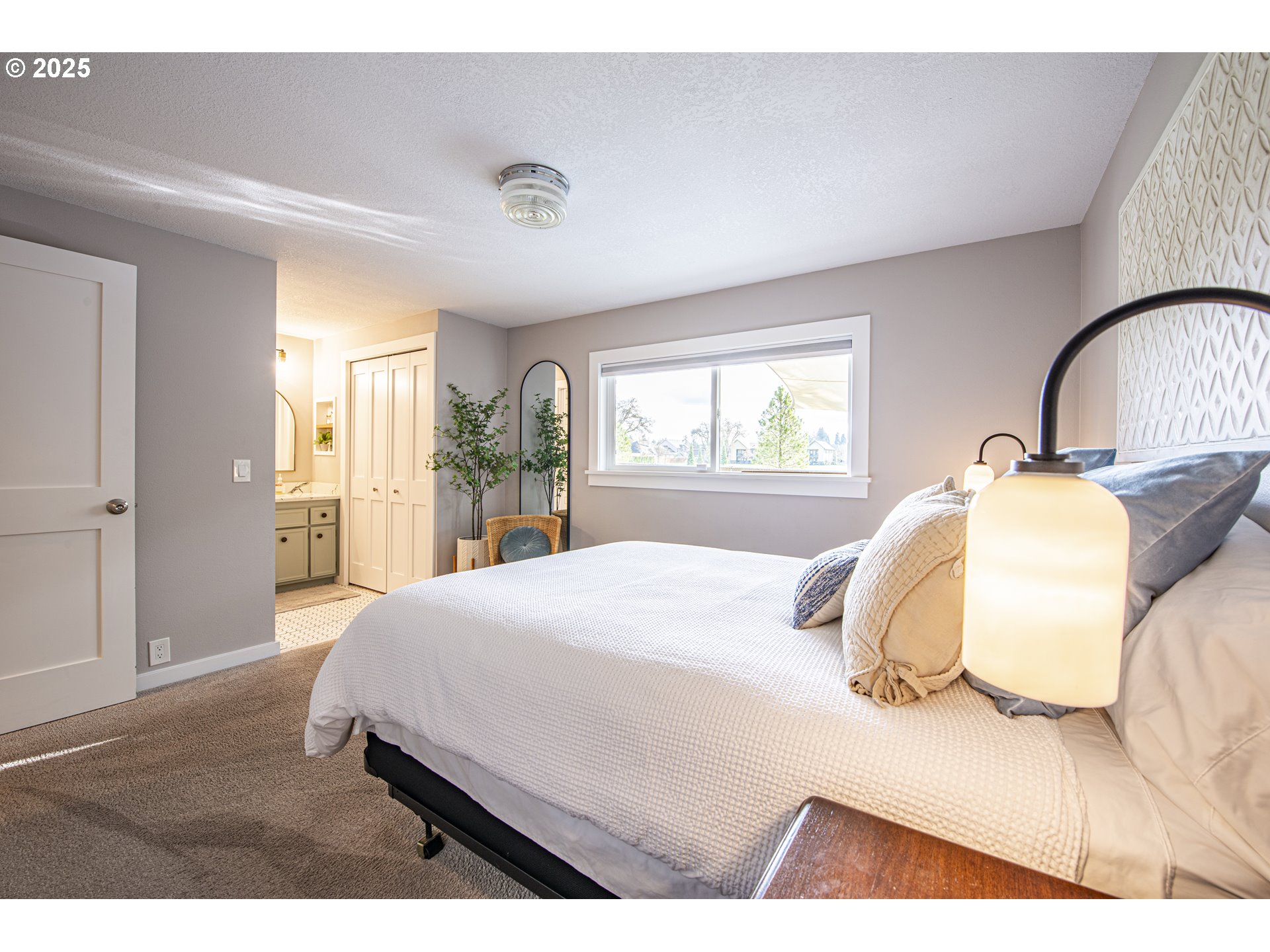 3052 Kentwood Drive Eugene, OR 97401 - Photo 27 of 43 a bedroom with a bed and wooden floor