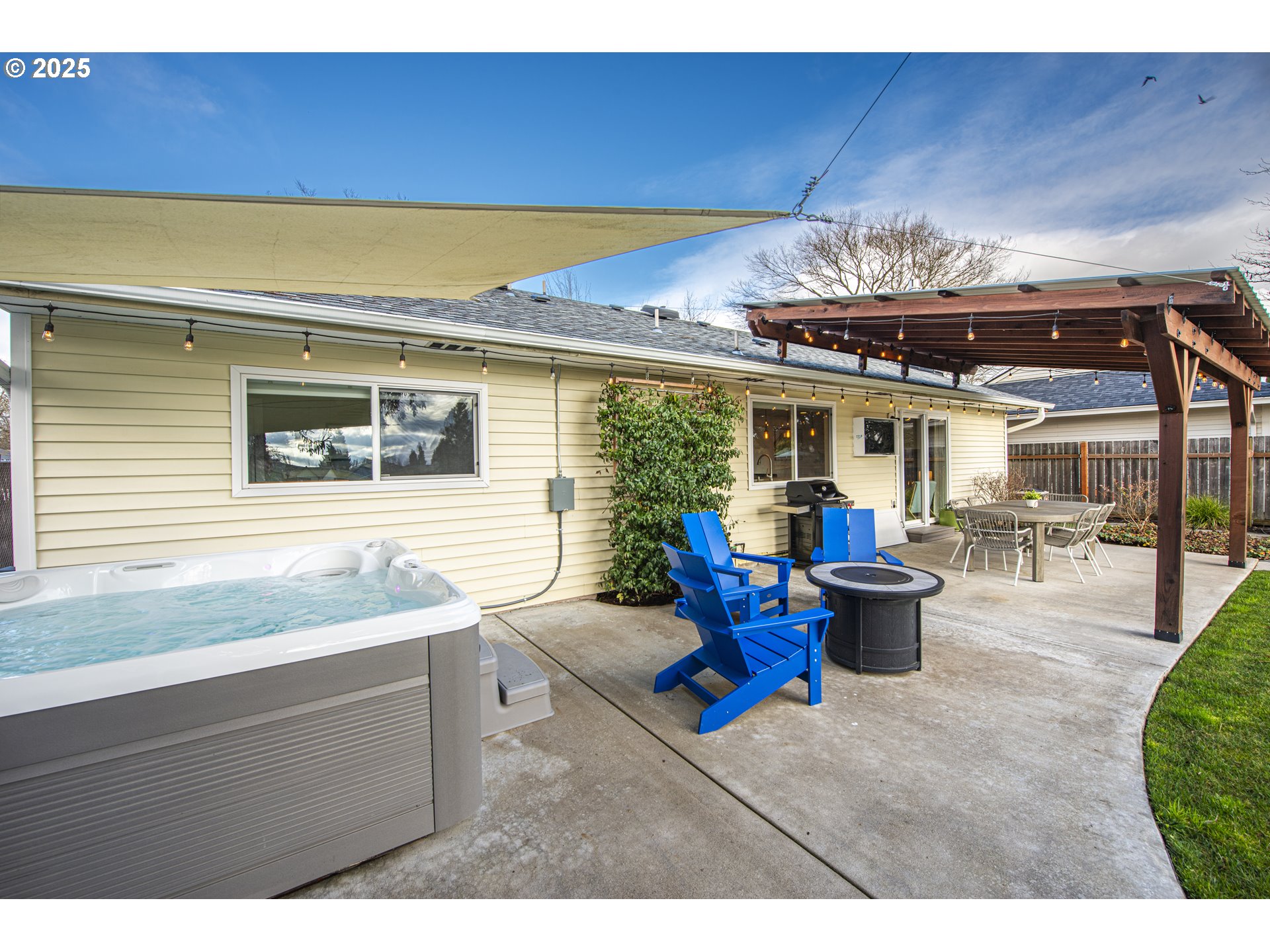 3052 Kentwood Drive Eugene, OR 97401 - Photo 34 of 43 a view of a dining room with furniture a kitchen and chandelier