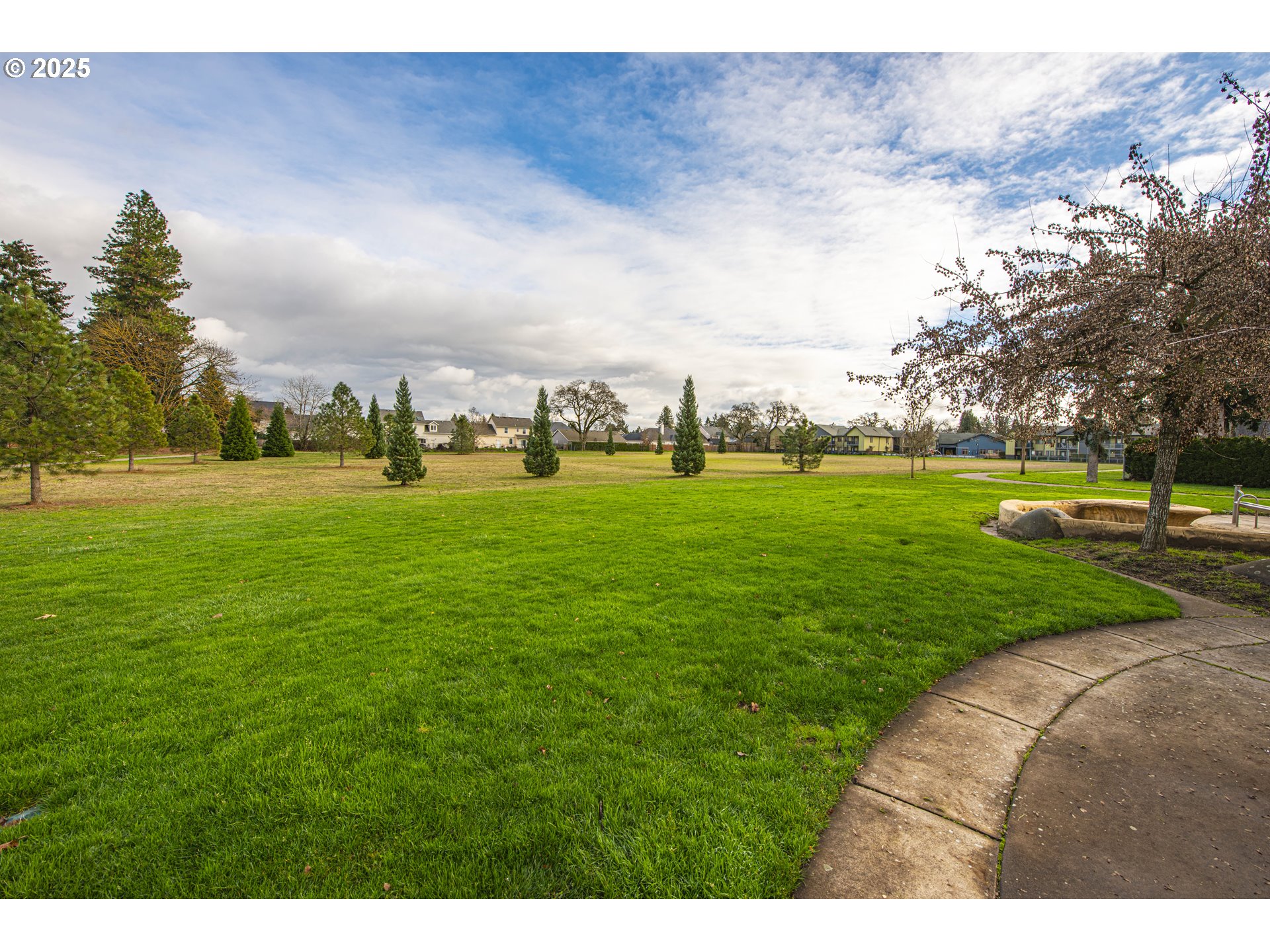 3052 Kentwood Drive Eugene, OR 97401 - Photo 41 of 43 a view of a big yard with a fountain and a large tree