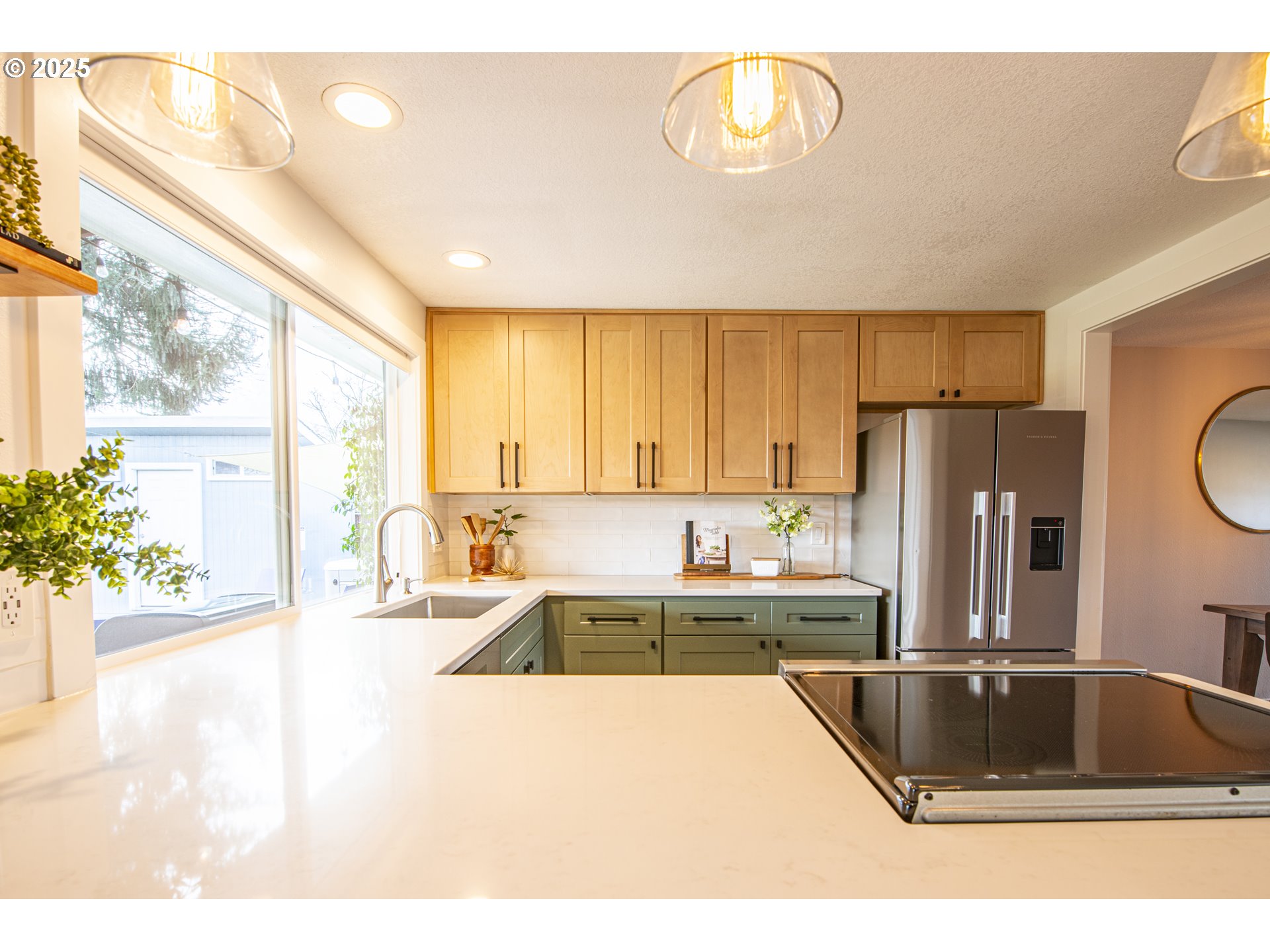 3052 Kentwood Drive Eugene, OR 97401 - Photo 10 of 43 a kitchen with a sink a counter top space cabinets and stainless steel appliances
