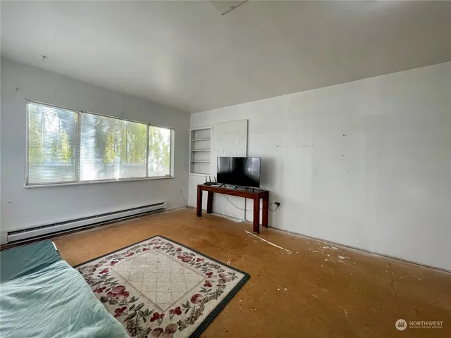 a living room with a rug