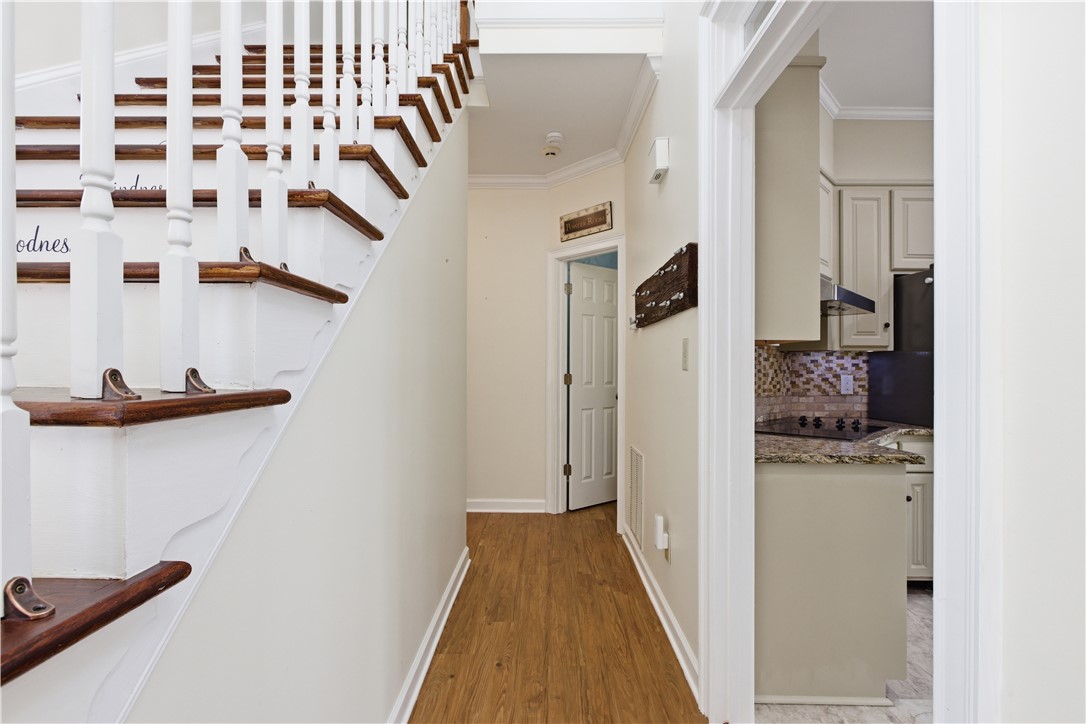 501 Capri Point Lavonia, GA 30553 - Photo 33 of 50 This entry hall features a staircase and opens to a kitchen, creating a seamless flow.