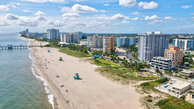 a view of kitchen with furniture and refrigerator