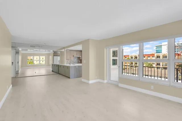 a kitchen with white cabinets and a stove top oven