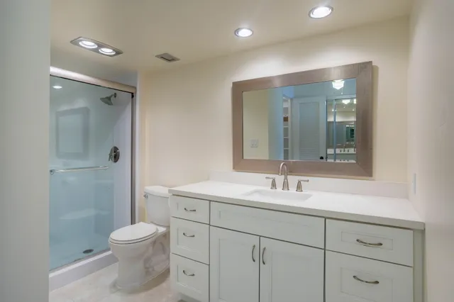 a lobby with furniture and floor to ceiling window