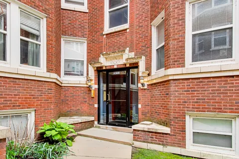 a brick building with a door and a window