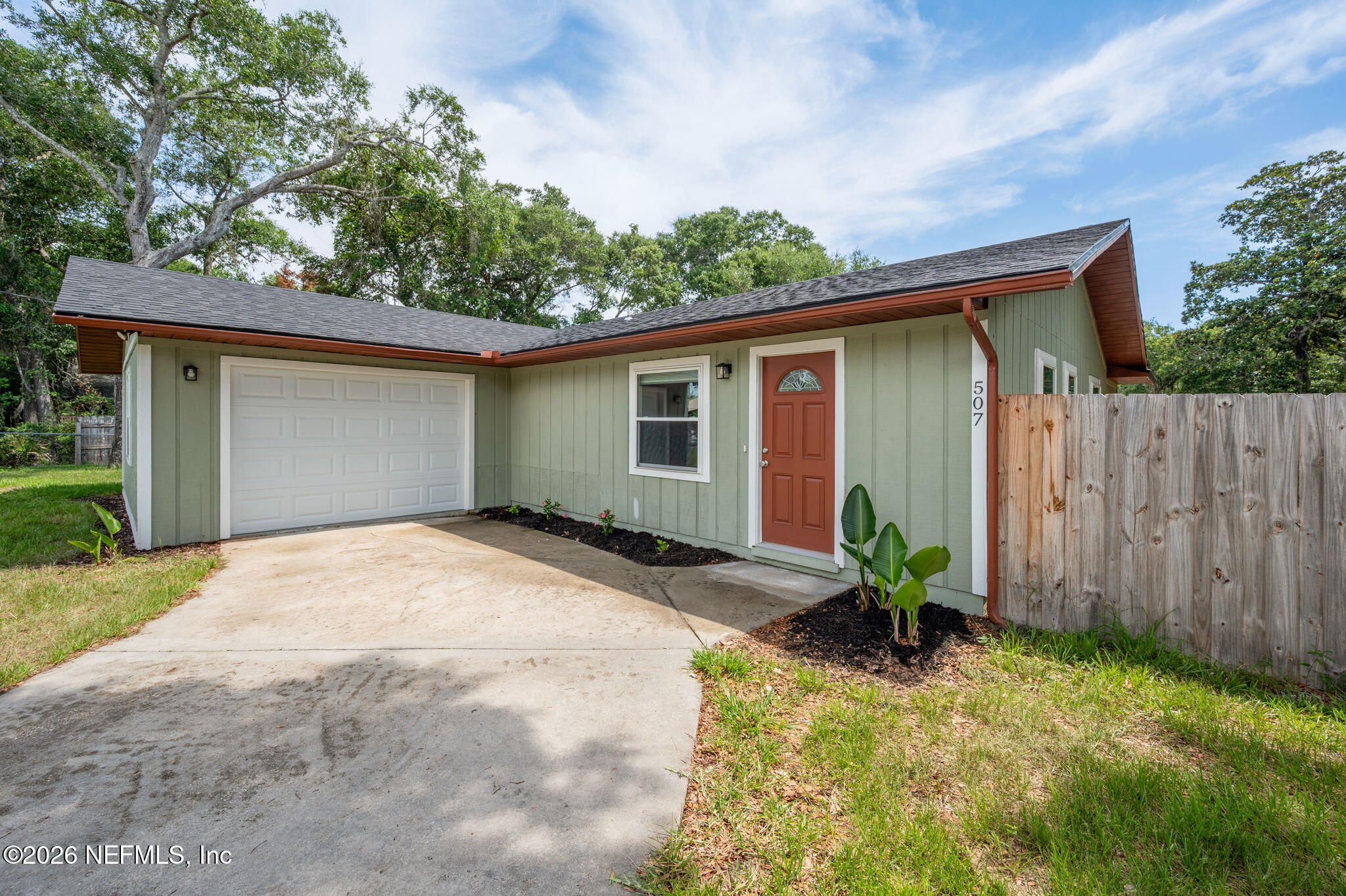 507 Gentian Road St. Augustine, FL 32086 - Photo 2 of 82 a front view of house with yard and trees in the background