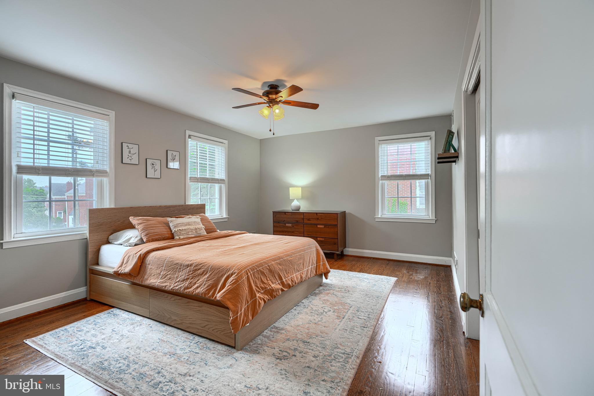 8132 Pleasant Plains Road Towson, MD 21286 - Photo 19 of 55 a bedroom with a bed ceiling fan and a window