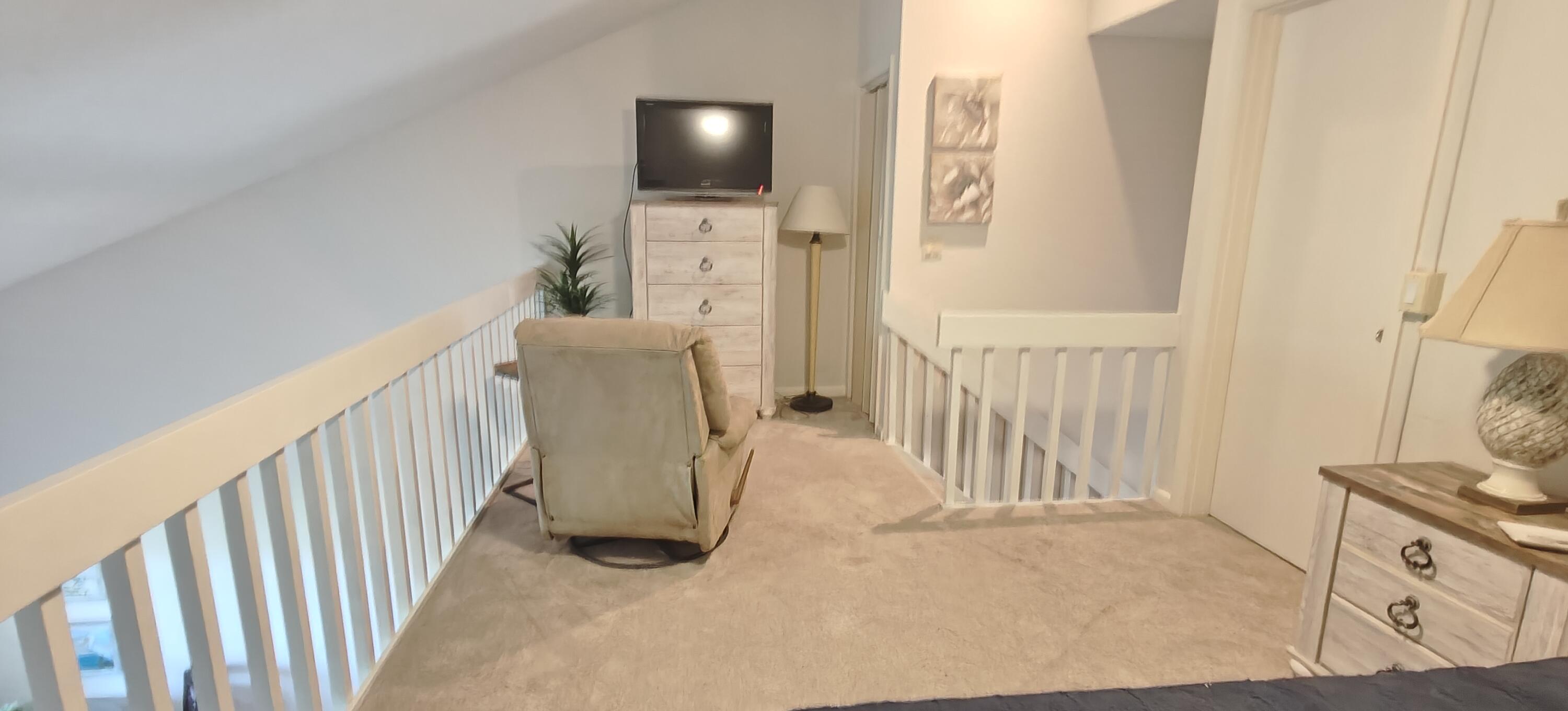 233 Northeast Edgewater Drive, Unit 203 Stuart, FL 34996 - Photo 17 of 30 a view of livingroom with furniture and windows