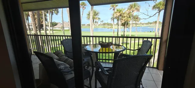 a view of a city from a dining room with large windows