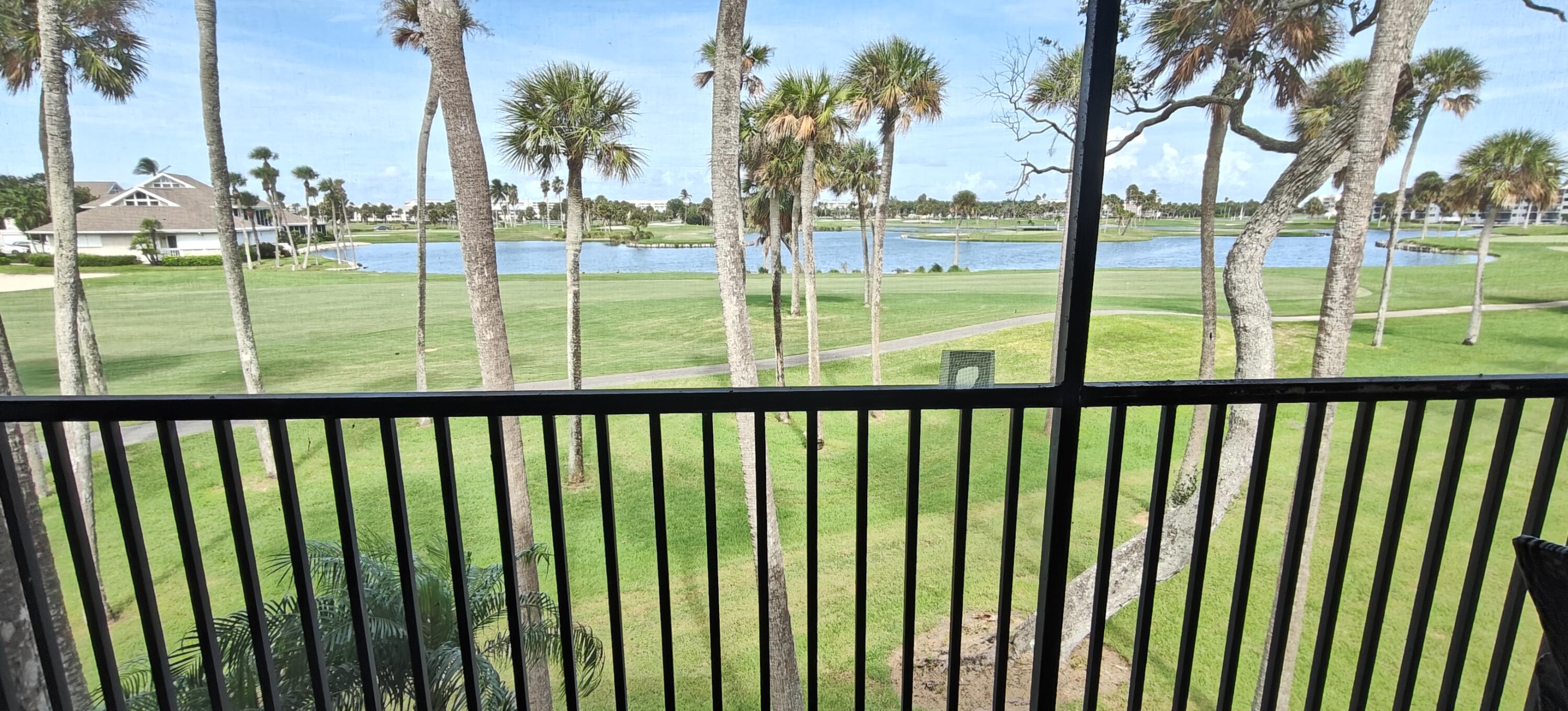 233 Northeast Edgewater Drive, Unit 203 Stuart, FL 34996 - Photo 3 of 30 a view of outdoor space with swimming pool