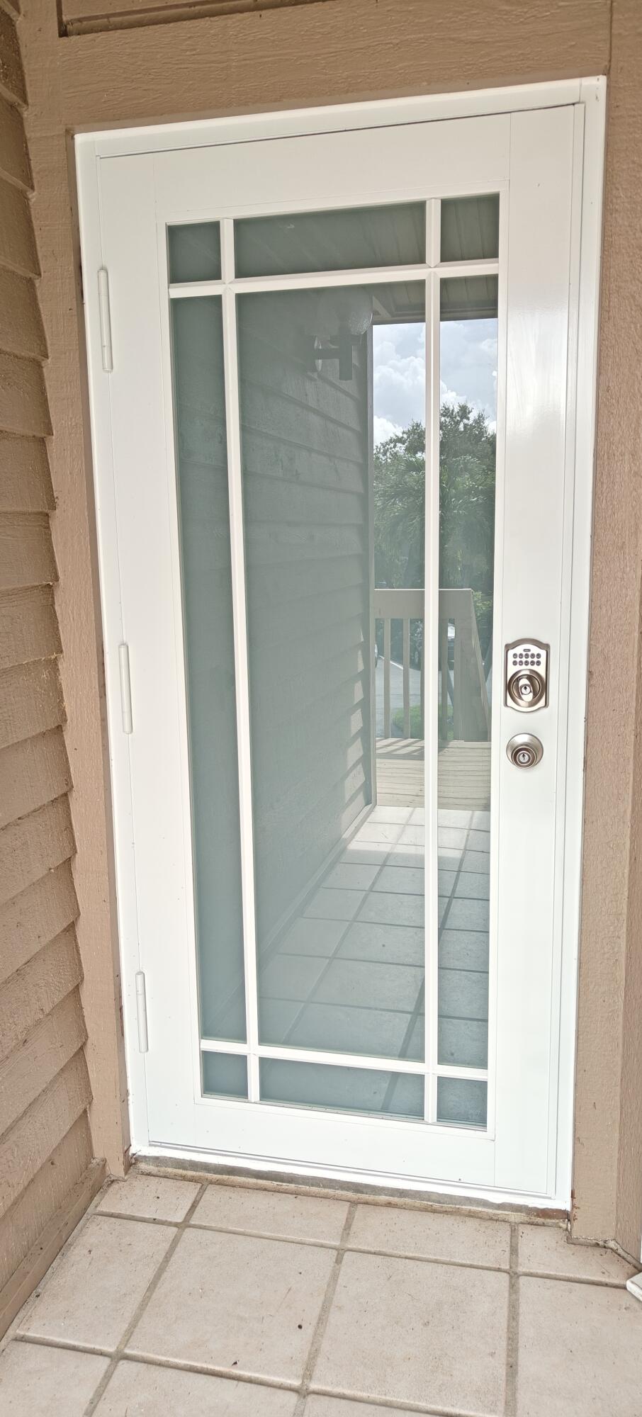 233 Northeast Edgewater Drive, Unit 203 Stuart, FL 34996 - Photo 9 of 30 a view of wooden door