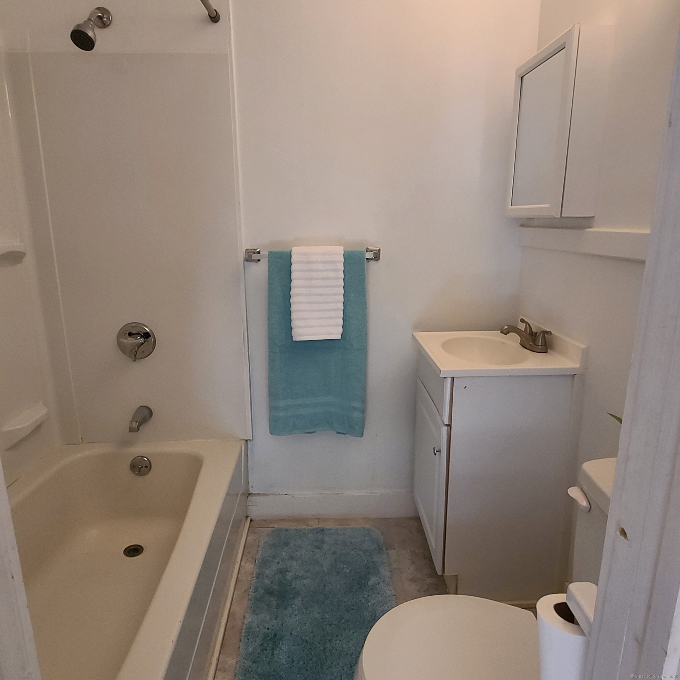 831 Boston Post Road Madison, CT 06443 - Photo 12 of 13 a bathroom with a sink toilet and shower